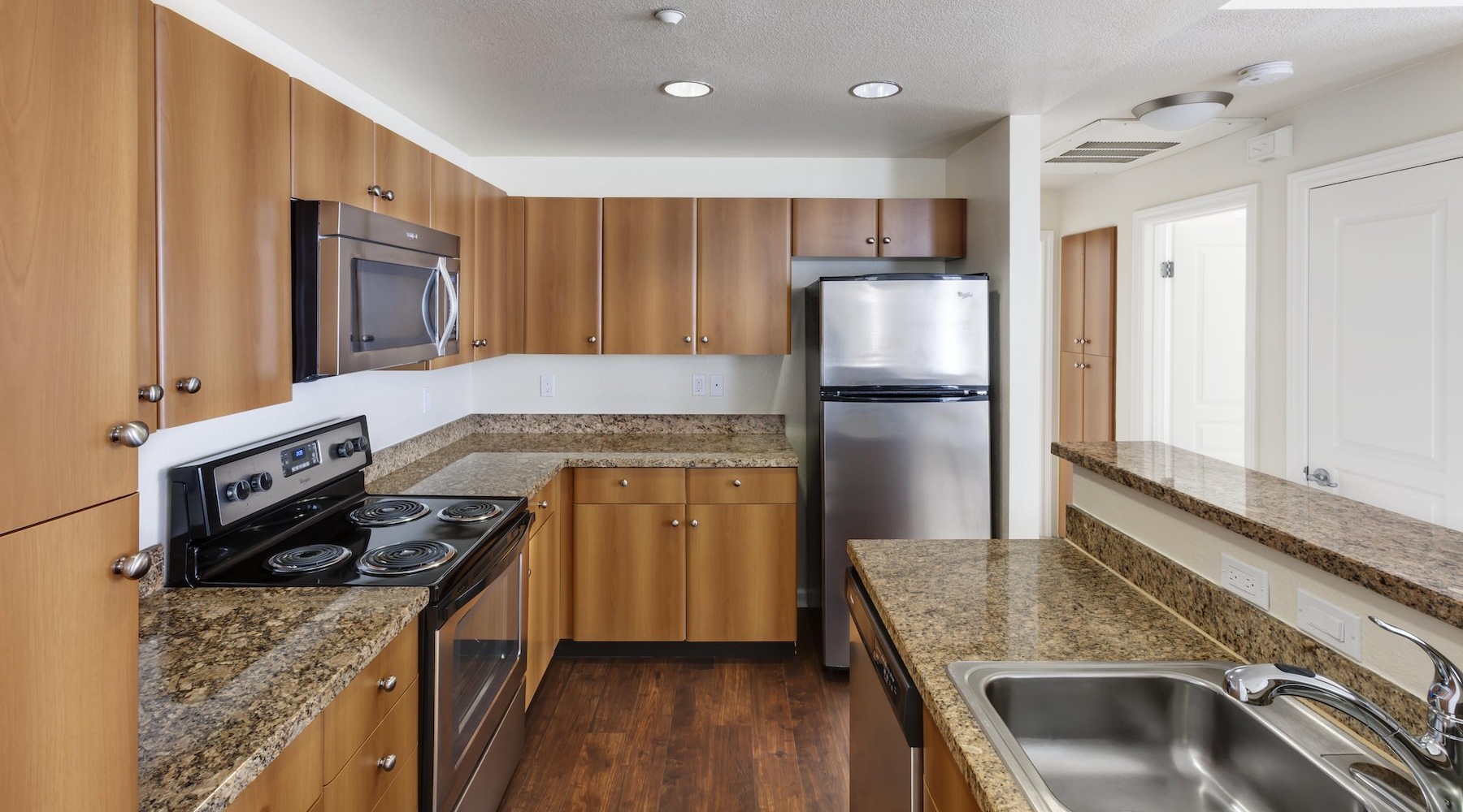 Spacious kitchens with everything you need kitchen with dark cabinets and stainless steel appliances