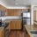 a kitchen with wooden cabinets
